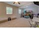 Spacious bedroom featuring neutral carpeting, a ceiling fan, bunk beds and dedicated study and play areas at 125 Mayo Rd, Covington, GA 30014