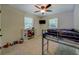 Bedroom featuring a bunk bed, neutral carpet, and natural light from two windows in a -friendly space at 125 Mayo Rd, Covington, GA 30014