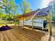 Lake house featuring a covered boat dock for convenient boat storage and easy access to the water at 125 Mayo Rd, Covington, GA 30014