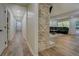 Hallway leading to the living area, complemented by light-colored walls and hardwood flooring at 125 Mayo Rd, Covington, GA 30014