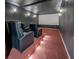 Home theater with tiered seating, projector screen, and custom lighting, perfect for movie nights at 125 Mayo Rd, Covington, GA 30014