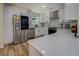 Beautiful modern kitchen with white cabinets, stainless steel appliances, and sleek countertops at 125 Mayo Rd, Covington, GA 30014