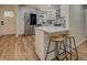 Stylish kitchen with white cabinetry, stainless steel appliances, and a breakfast bar for casual dining at 125 Mayo Rd, Covington, GA 30014