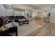 Spacious living room featuring an open layout, hardwood floors, and seamless flow into the kitchen and dining area at 125 Mayo Rd, Covington, GA 30014