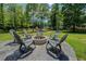 This patio is designed for relaxation around a fire pit, surrounded by comfortable seating at 125 Mayo Rd, Covington, GA 30014