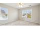 Comfortable bedroom with carpeted floors and two windows providing natural light at 1605 Gilstrap Nw Ln, Atlanta, GA 30318