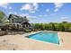 Community pool and clubhouse with ample seating and landscaped surroundings at 1605 Gilstrap Nw Ln, Atlanta, GA 30318