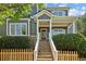Inviting front entrance featuring stone stairs, a red door, and well-maintained landscaping, enhancing curb appeal at 1605 Gilstrap Nw Ln, Atlanta, GA 30318