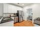 Bright kitchen with stainless steel appliances, granite countertops and white cabinets at 1605 Gilstrap Nw Ln, Atlanta, GA 30318