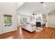 Spacious living room featuring a fireplace, built-in shelving, hardwood floors, and ample natural light at 1605 Gilstrap Nw Ln, Atlanta, GA 30318