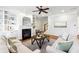 Bright living room features built-in shelving, fireplace, and hardwood floors at 1605 Gilstrap Nw Ln, Atlanta, GA 30318