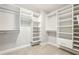Organized walk-in closet with custom shelving and ample storage space at 1605 Gilstrap Nw Ln, Atlanta, GA 30318
