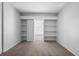 Bedroom offers a large window, carpet, and ample storage via built in shelves at 3648 Peachtree Ne Rd # 2Q, Atlanta, GA 30319