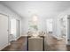 Chic dining room featuring contemporary lighting, stylish decor, and hardwood floors at 3648 Peachtree Ne Rd # 2Q, Atlanta, GA 30319