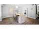 Open-concept dining area with modern decor, chandelier, and views into the kitchen at 3648 Peachtree Ne Rd # 2Q, Atlanta, GA 30319