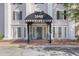 Inviting building entrance featuring a striped awning and classic architectural details at 3648 Peachtree Ne Rd # 2Q, Atlanta, GA 30319