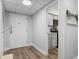 Clean hallway leading to a kitchen area, showcasing modern fixtures and finishes at 3648 Peachtree Ne Rd # 2Q, Atlanta, GA 30319