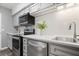 Well-lit kitchen with modern stainless steel appliances and white subway tile at 3648 Peachtree Ne Rd # 2Q, Atlanta, GA 30319