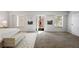 Bright bedroom with a large bed and bench, featuring carpeted floors at 3648 Peachtree Ne Rd # 2Q, Atlanta, GA 30319