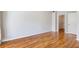 Neutral bedroom with polished hardwood floors, closet, and large door at 375 Highland Ne Ave # 1011, Atlanta, GA 30312