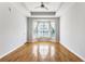 Primary bedroom featuring hardwood floors, bay windows, and ceiling fan at 375 Highland Ne Ave # 1011, Atlanta, GA 30312