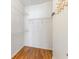 Walk-in closet includes hardwood floors and multiple shelving units at 375 Highland Ne Ave # 1011, Atlanta, GA 30312