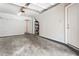 A spacious garage space with concrete flooring, shelving, and access door at 375 Highland Ne Ave # 1011, Atlanta, GA 30312