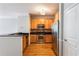 Well-equipped kitchen with stainless steel appliances, wood cabinets, and sleek black countertops at 375 Highland Ne Ave # 1011, Atlanta, GA 30312