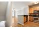 Open kitchen layout with stainless steel appliances, wooden cabinets, and hardwood floors at 375 Highland Ne Ave # 1011, Atlanta, GA 30312