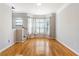 Open living room with hardwood flooring, natural light, and staircase to second floor at 375 Highland Ne Ave # 1011, Atlanta, GA 30312