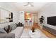 Spacious living room with stylish furnishings, hardwood floors, and a view into the kitchen at 375 Highland Ne Ave # 1011, Atlanta, GA 30312