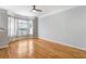 Bright living room featuring hardwood floors, large windows, and neutral wall paint at 375 Highland Ne Ave # 1011, Atlanta, GA 30312