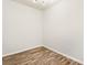 A well-lit room featuring wood laminate flooring, fresh paint, and modern lighting at 375 Highland Ne Ave # 1011, Atlanta, GA 30312