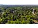 An aerial view shows the lovely wooded neighborhood surrounding this home at 4257 Webb Rd, Tucker, GA 30084