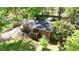 Aerial view of a brick house with a large backyard and mature trees at 4257 Webb Rd, Tucker, GA 30084