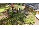 Backyard view of a multi-level wooden deck, outdoor furniture, and blooming shrubs at 4257 Webb Rd, Tucker, GA 30084
