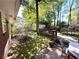 Brick home exterior with a backyard deck surrounded by mature landscaping and a storage shed at 4257 Webb Rd, Tucker, GA 30084