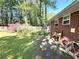 Backyard next to a brick house featuring a shed and a lawn at 4257 Webb Rd, Tucker, GA 30084