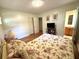 Bright bedroom with hardwood floors and a view into the bathroom at 4257 Webb Rd, Tucker, GA 30084