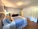 Bright bedroom with wood floors, neutral paint, and soft lighting at 4257 Webb Rd, Tucker, GA 30084