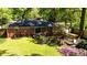 A well-maintained backyard with lush grass, a patio, and a brick house at 4257 Webb Rd, Tucker, GA 30084
