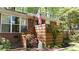 Brick home with lush landscaping, American flag, and covered front entry at 4257 Webb Rd, Tucker, GA 30084