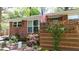 Exterior of a brick home with an American flag and mature landscaping at 4257 Webb Rd, Tucker, GA 30084