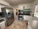 This kitchen offers stainless steel appliances, lots of cabinet space, and views to the living room at 4257 Webb Rd, Tucker, GA 30084