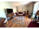 Comfortable living area with hardwood floors, vintage decor, and lots of natural light at 4257 Webb Rd, Tucker, GA 30084