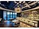Elegant bar area with a fully stocked shelves and stylish seating at 100 Carlyle Ln, Fayetteville, GA 30214