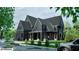 New construction home with neutral colors and traditional architecture at 100 Carlyle Ln, Fayetteville, GA 30214