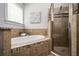 Bathroom with soaker tub and glass shower at 1233 Ashford Creek Ne Park, Atlanta, GA 30319