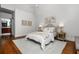 Bright bedroom features hardwood floors, neutral decor and ensuite bathroom at 1233 Ashford Creek Ne Park, Atlanta, GA 30319