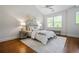 Bright bedroom with vaulted ceiling, hardwood floors, bench and neutral decor at 1233 Ashford Creek Ne Park, Atlanta, GA 30319